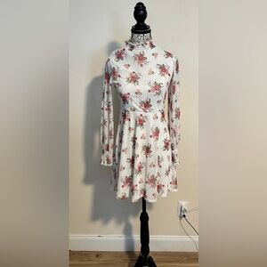 Mikey & JoeyFloral Dress. Lots of stretch. Fully lined. Sheer sleeves